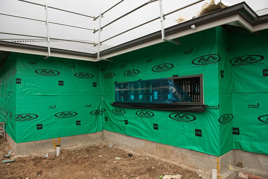 A house under construction showing wall wrap installed