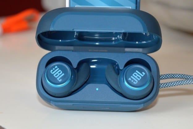 A pair of JBL Reflect Mini NC earbuds