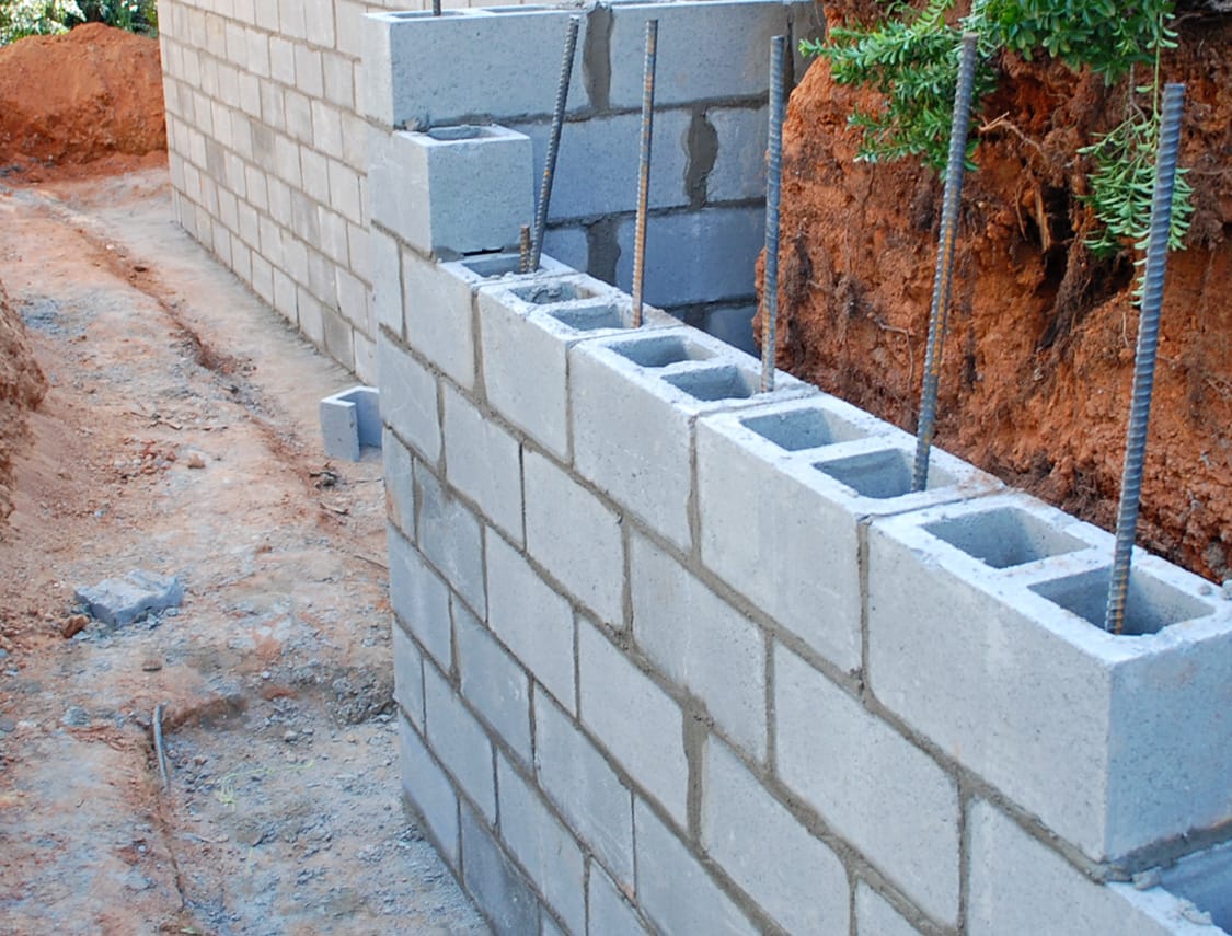 Concrete block retining wall
