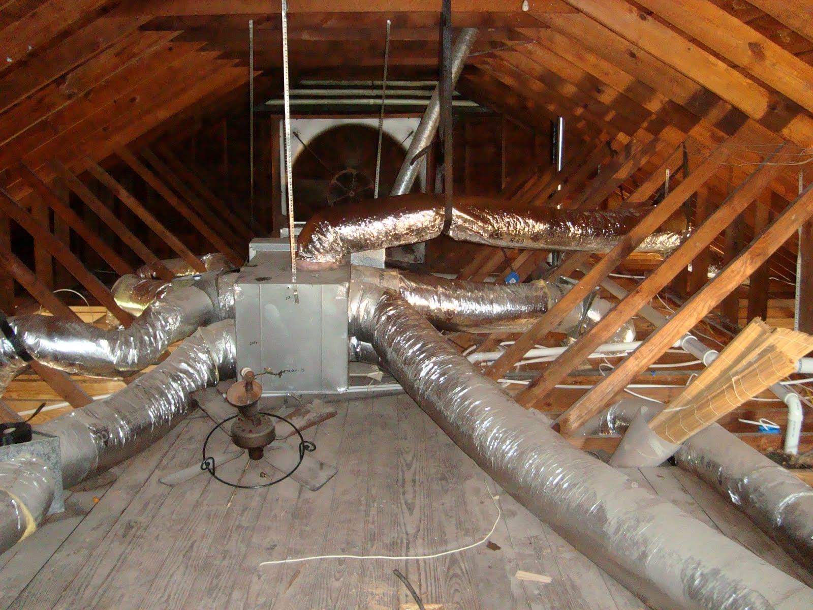 a shitty ac duct installation in a roof space